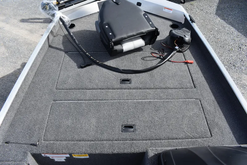 Slide: The Image of 2025 Crestliner 1700 Storm boat interior with storage compartments and seating. - 6