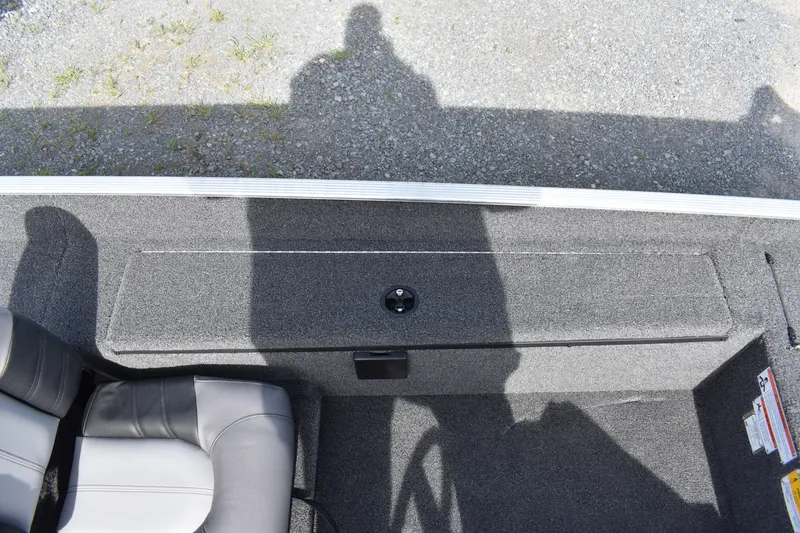 Slide: The Image of 2025 Crestliner 1700 Storm boat interior with seating and storage compartment. - 7