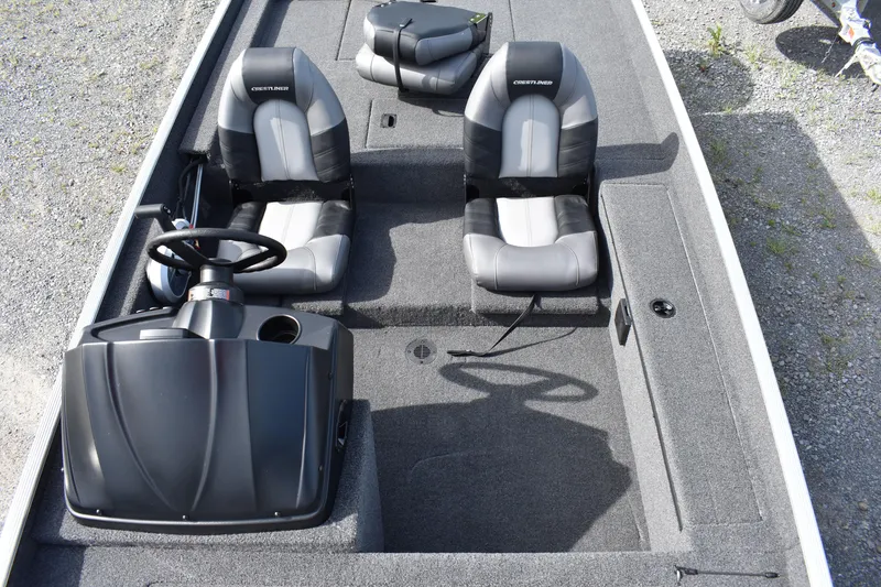Slide: The Image of 2025 Crestliner 1700 Storm boat interior with dual seats and steering console. - 9