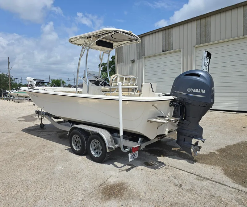 Slide: The Image of 2021 Carolina Skiff 21 LS boat with Yamaha outboard motor on a trailer. - 1