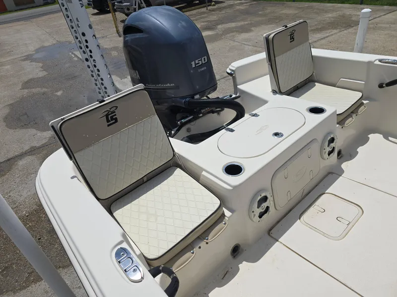 Slide: The Image of 2021 Carolina Skiff 21 LS boat interior with seating and 150 horsepower outboard motor. - 10