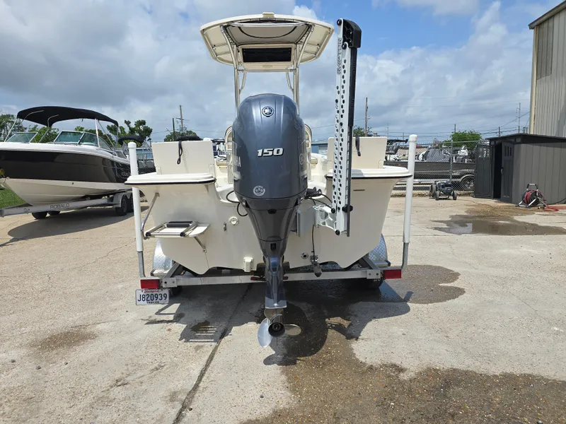 Slide: The Image of 2021 Carolina Skiff 21 LS boat with 150 HP engine on a trailer. - 3