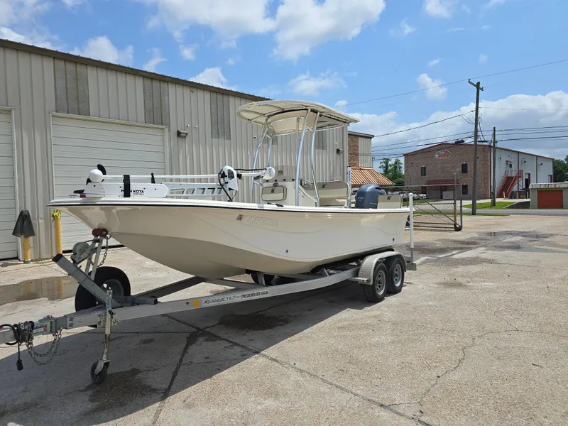 Slide: The Image of 2021 Carolina Skiff 21 LS boat on trailer, parked outside industrial building. - 4