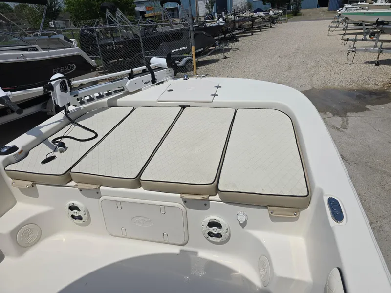 Slide: The Image of 2021 Carolina Skiff 21 LS boat deck with cushioned seating and storage compartments. - 5