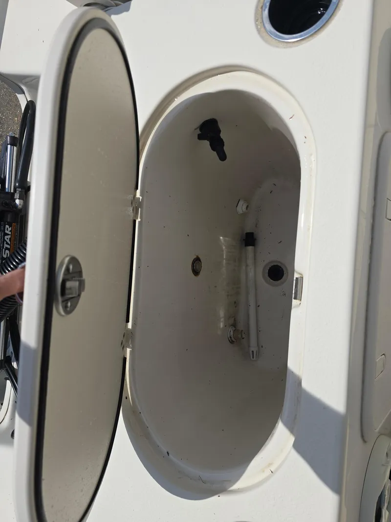Slide: The Image of Open storage compartment on a 2021 Carolina Skiff 21 LS boat. - 9