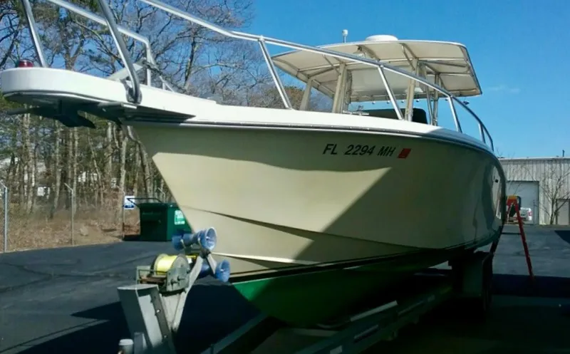 Slide: The Image of 2000 Venture 34 Center Console boat on trailer, parked outdoors. - 23