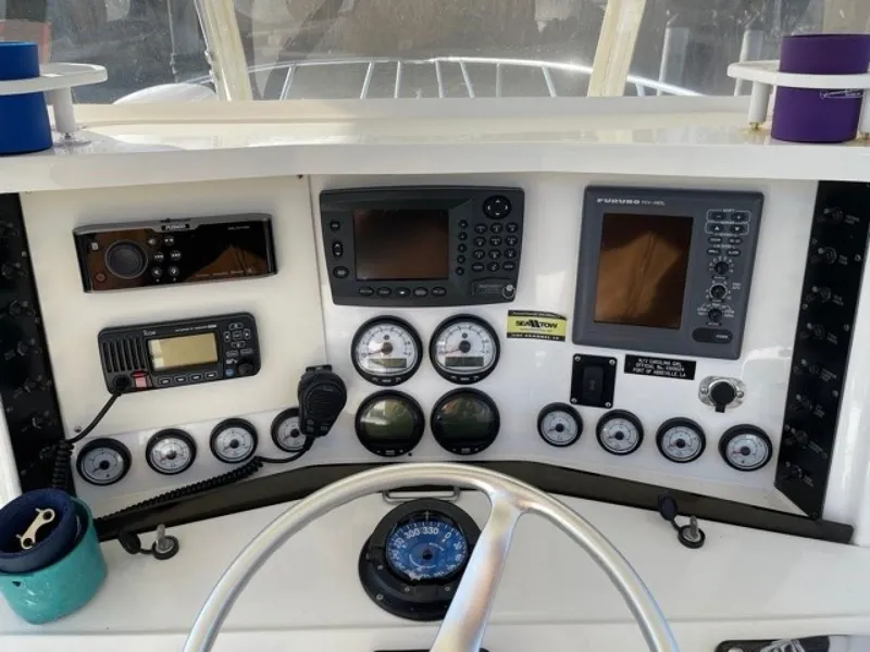 Slide: The Image of Control panel of a 2000 Venture 34 Center Console boat with navigation instruments. - 5