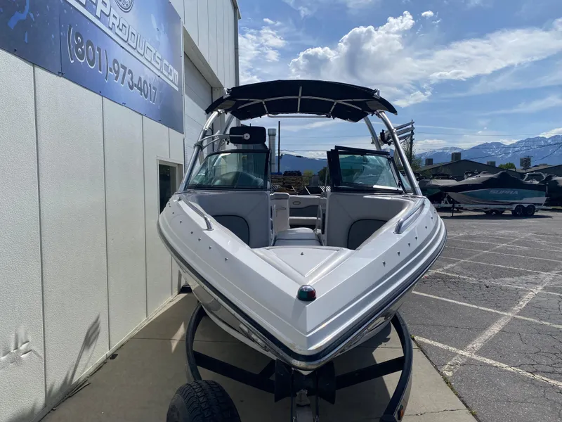 Slide: The Image of 2006 Supra Launch 24 SSV boat parked outdoors on a trailer. - 3