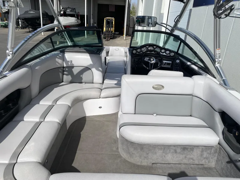 Slide: The Image of 2006 Supra Launch 24 SSV boat interior with spacious seating and sleek design. - 6