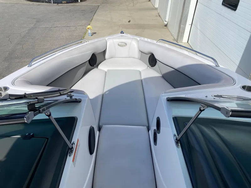 Slide: The Image of 2006 Supra Launch 24 SSV boat interior with gray seating and sleek design. - 7