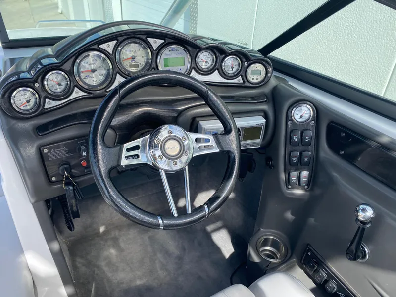Slide: The Image of 2006 Supra Launch 24 SSV dashboard with steering wheel and instrument panel. - 8