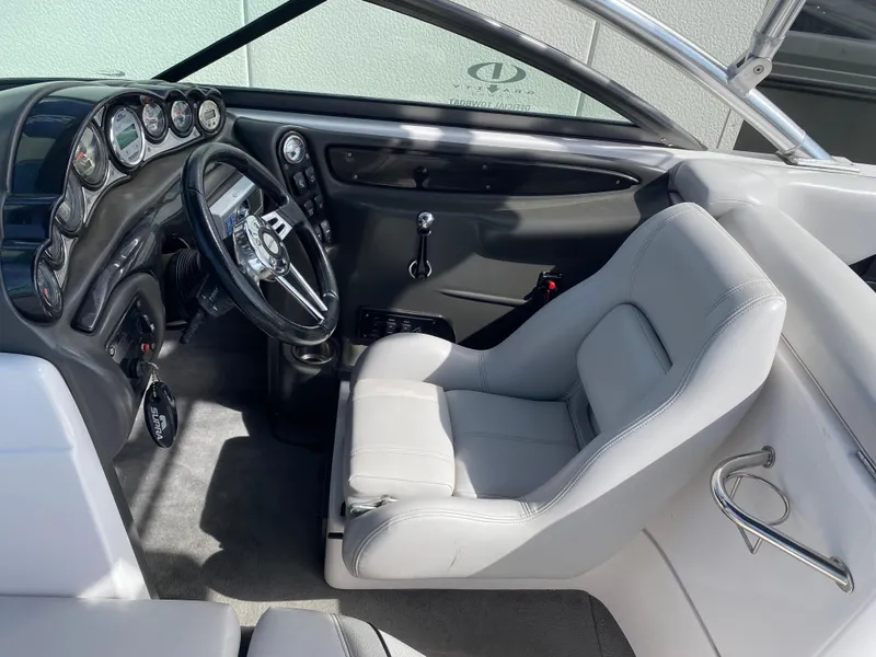 Slide: The Image of 2006 Supra Launch 24 SSV boat interior with steering wheel and dashboard controls. - 9