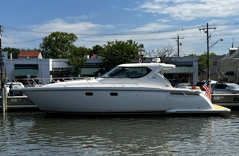 Slide: The Image of 2006 Tiara Yachts 4300 Sovran docked in a marina, side view. - 1