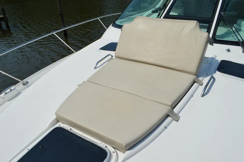 Slide: The Image of 2006 Tiara Yachts 4300 Sovran sunpad on deck, featuring comfortable beige cushions. - 12