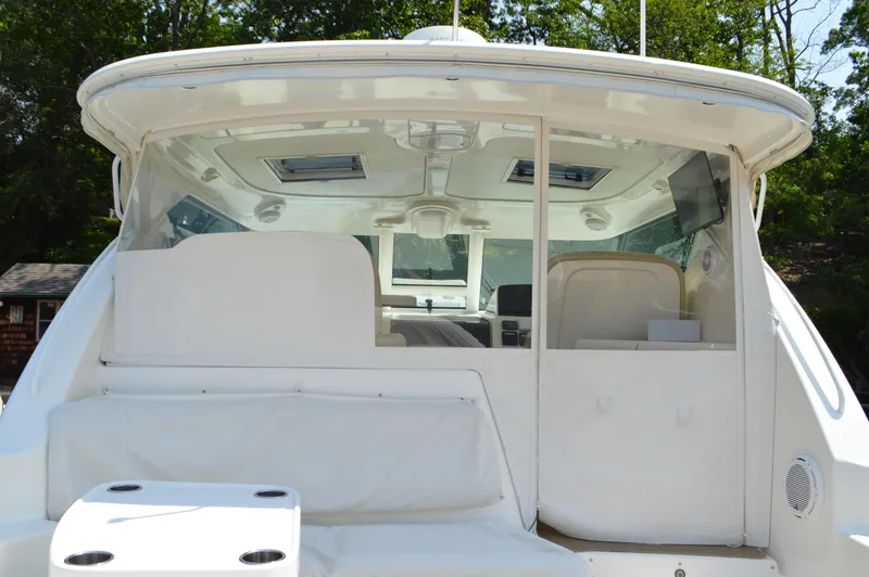 Slide: The Image of 2006 Tiara Yachts 4300 Sovran, rear view of cockpit and seating area. - 14