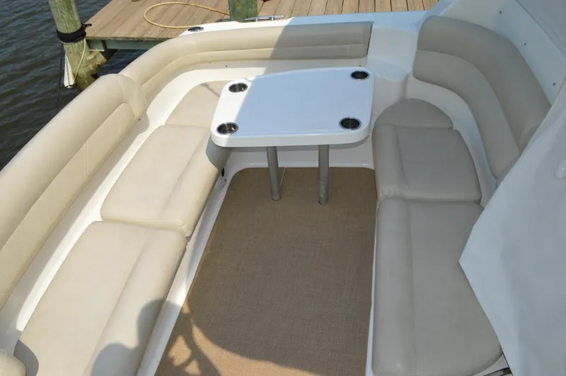 Slide: The Image of 2006 Tiara Yachts 4300 Sovran seating area with table on deck. - 16