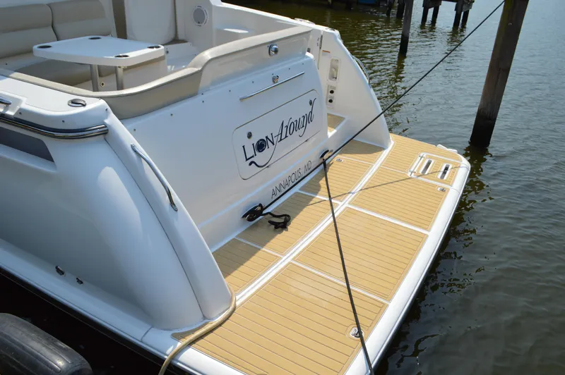 Slide: The Image of 2006 Tiara Yachts 4300 Sovran, rear view with teak swim platform, docked. - 19