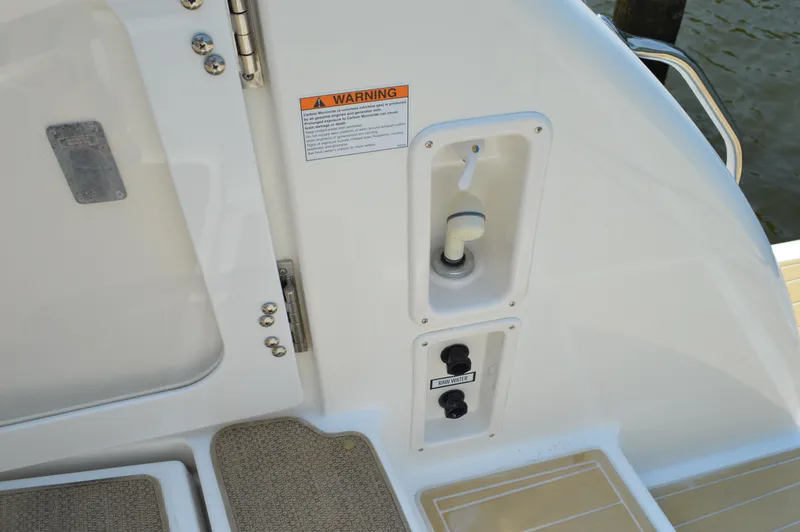 Slide: The Image of 2006 Tiara Yachts 4300 Sovran deck detail with warning label and controls. - 22