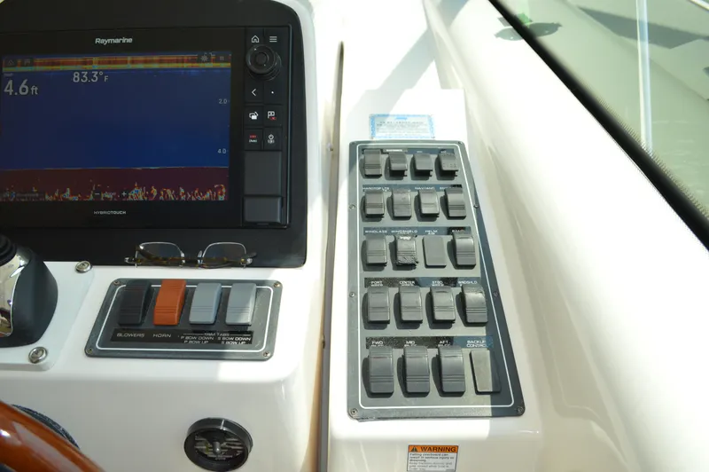 Slide: The Image of Control panel of 2006 Tiara Yachts 4300 Sovran with navigation display and switches. - 31