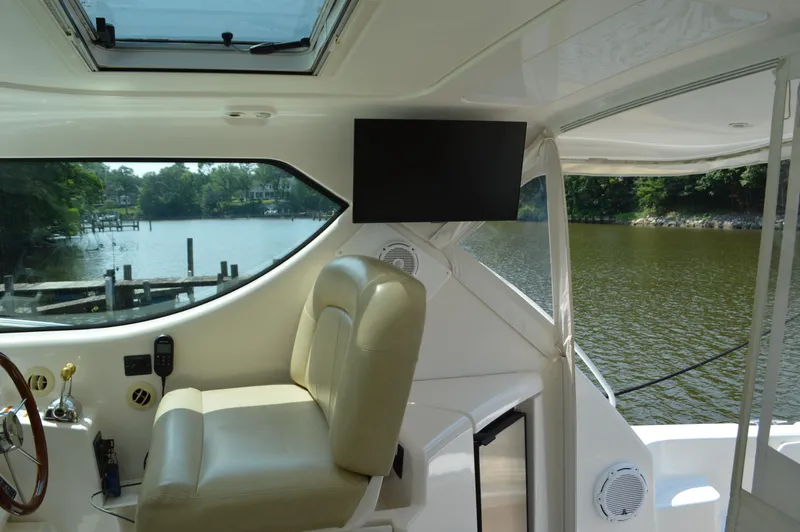 Slide: The Image of Interior of 2006 Tiara Yachts 4300 Sovran with helm seat and water view. - 34