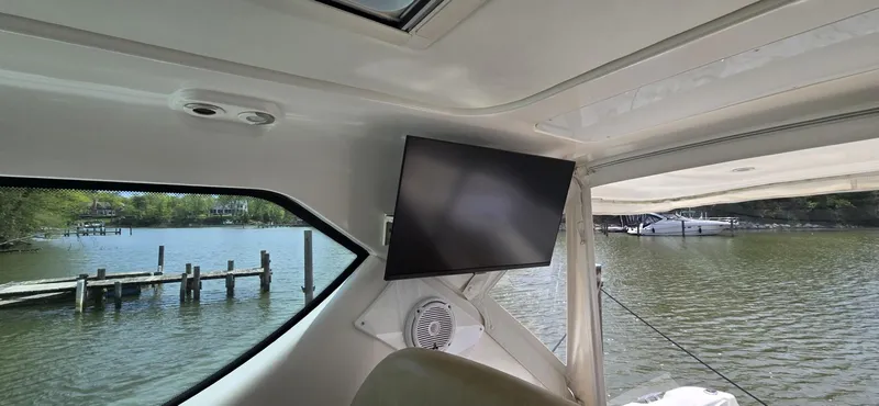 Slide: The Image of Interior view of 2006 Tiara Yachts 4300 Sovran with TV and water view. - 35