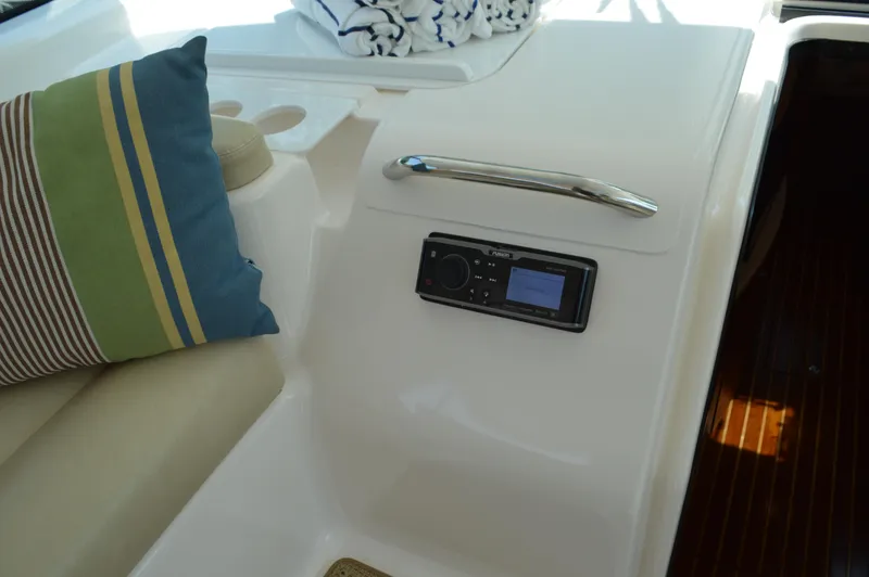 Slide: The Image of 2006 Tiara Yachts 4300 Sovran interior with control panel and striped cushion. - 41