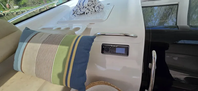 Slide: The Image of 2006 Tiara Yachts 4300 Sovran interior with striped pillow and control panel. - 44