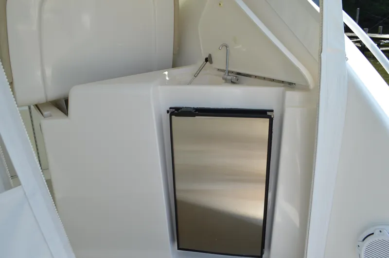 Slide: The Image of 2006 Tiara Yachts 4300 Sovran kitchenette with stainless steel mini-fridge and sink. - 45