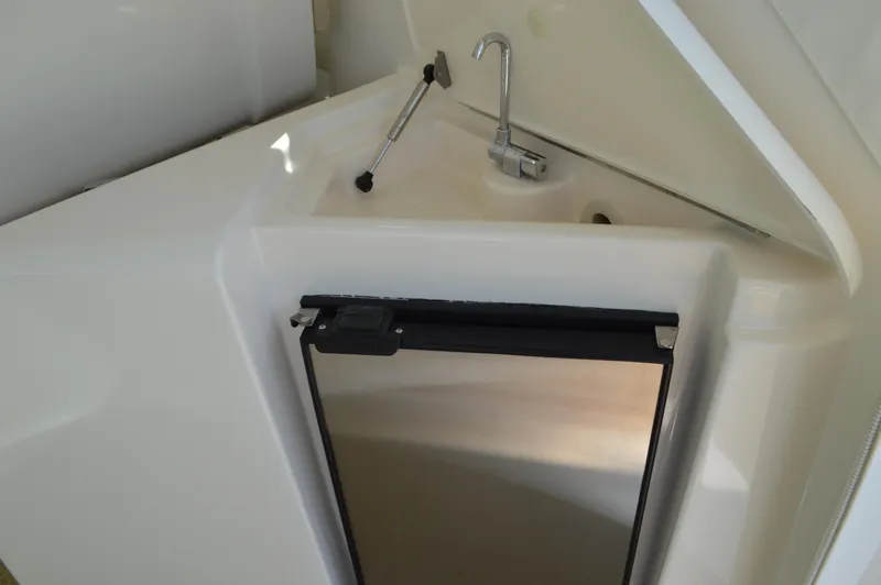 Slide: The Image of 2006 Tiara Yachts 4300 Sovran interior sink and mini fridge detail. - 46