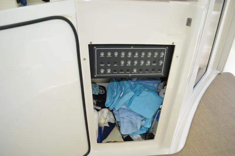 Slide: The Image of Electrical panel and storage compartment on 2006 Tiara Yachts 4300 Sovran. - 47