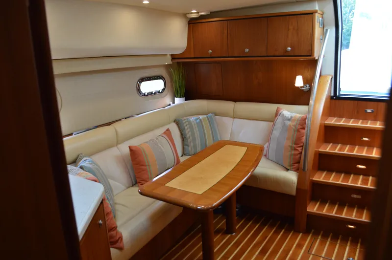 Slide: The Image of Luxurious interior of 2006 Tiara Yachts 4300 Sovran with elegant seating and wooden finishes. - 49