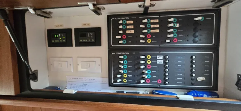 Slide: The Image of Electrical control panel inside a 2006 Tiara Yachts 4300 Sovran boat. - 54
