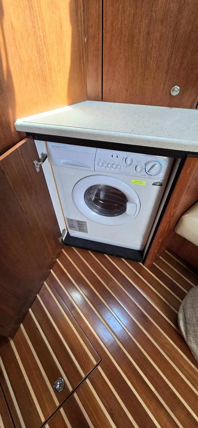 Slide: The Image of 2006 Tiara Yachts 4300 Sovran interior with built-in washing machine. - 57