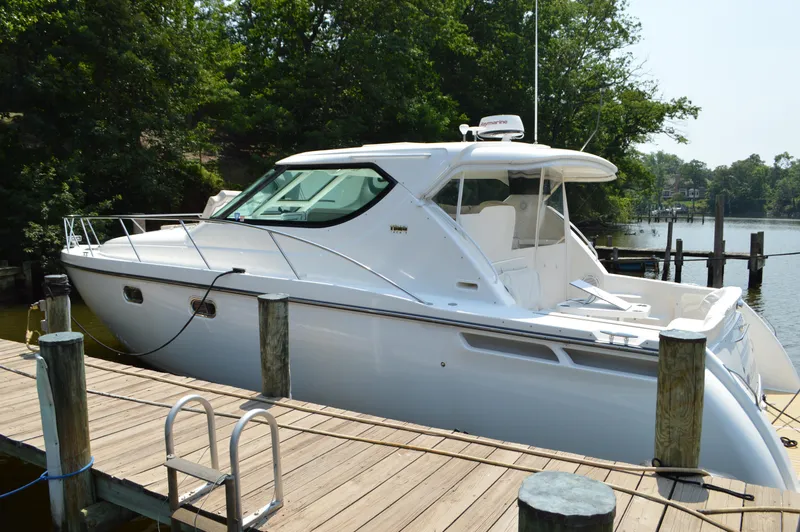 Slide: The Image of 2006 Tiara Yachts 4300 Sovran docked, showcasing sleek design and luxury features. - 7