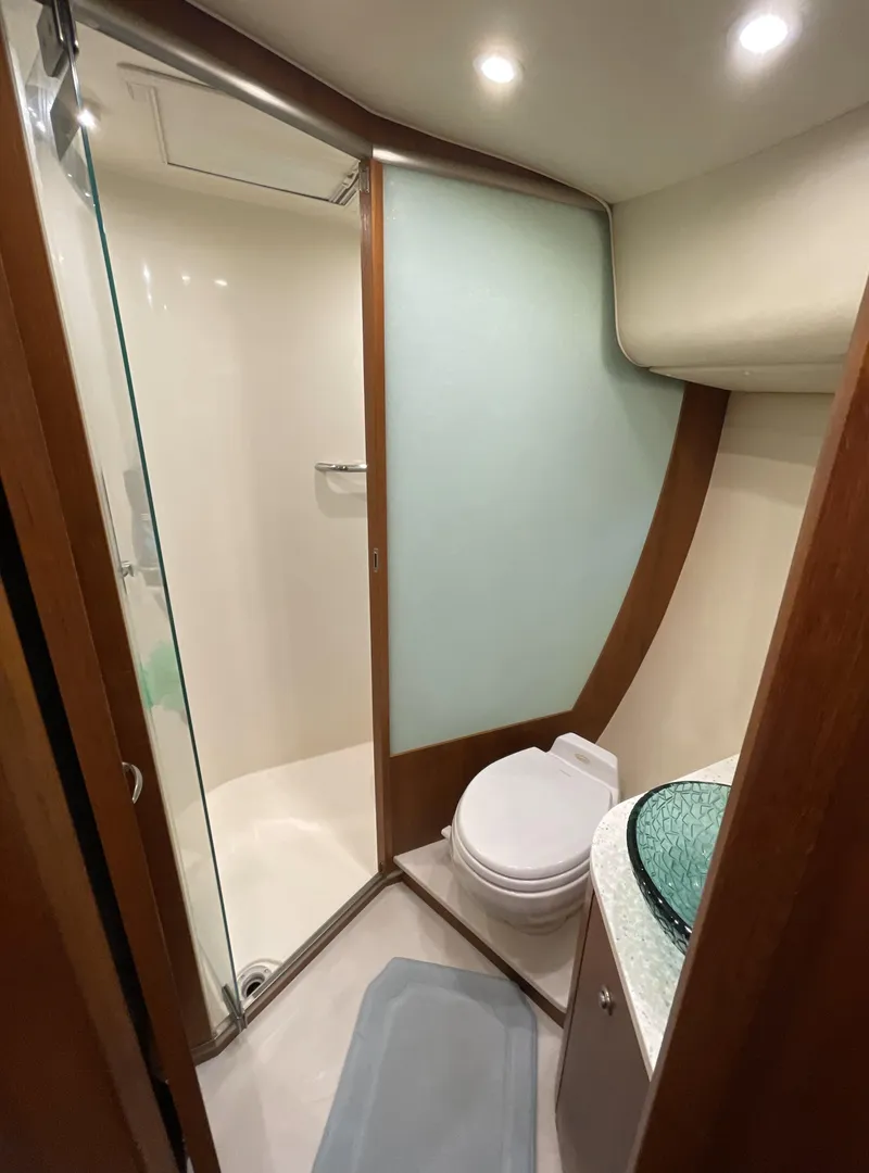 Slide: The Image of 2006 Tiara Yachts 4300 Sovran bathroom with modern shower and glass sink. - 75