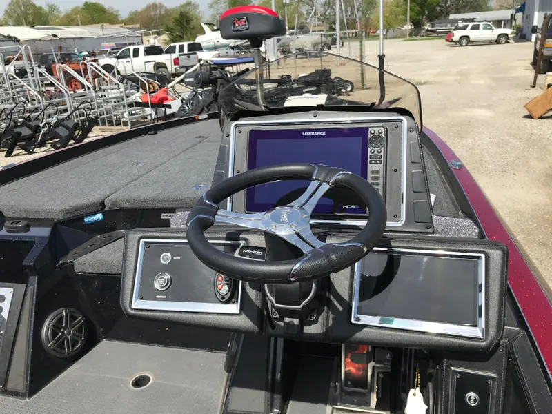 Slide: The Image of 2023 Ranger Z520R boat dashboard with steering wheel and electronic displays. - 15