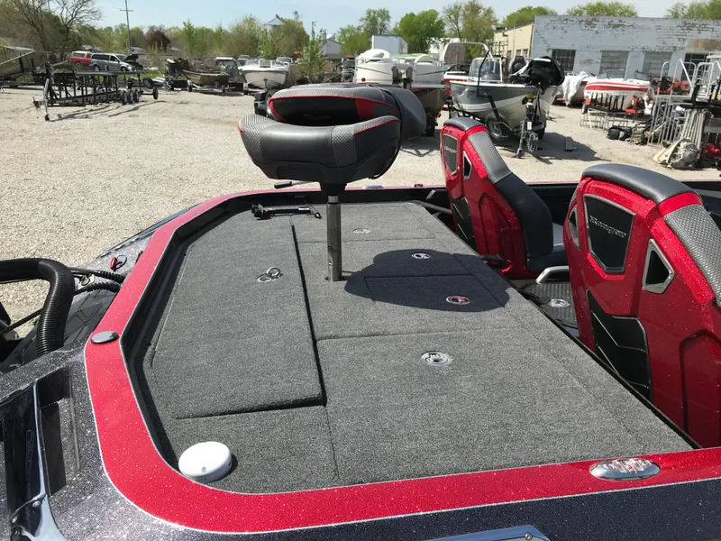 Slide: The Image of 2023 Ranger Z520R boat with red accents, featuring a spacious deck and comfortable seating. - 17