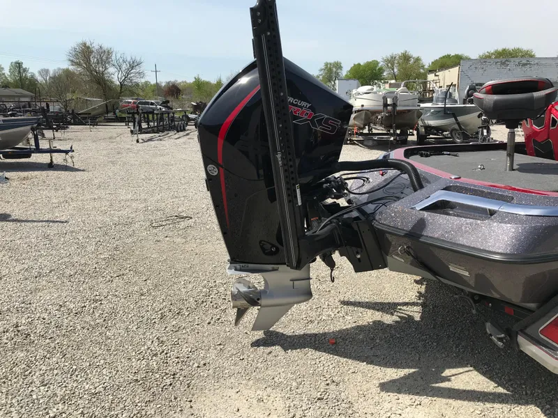 Slide: The Image of 2023 Ranger Z520R boat with powerful Mercury engine, parked on gravel lot. - 19