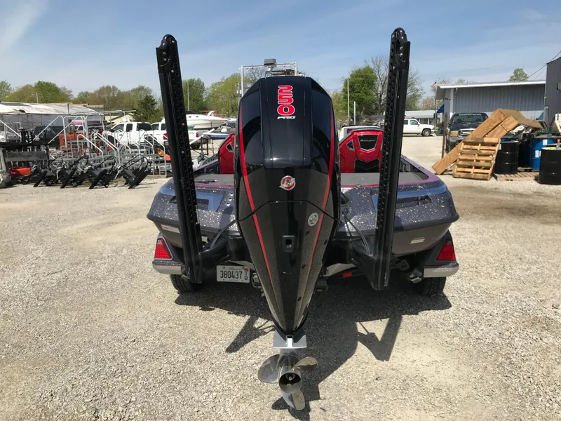 Slide: The Image of 2023 Ranger Z520R boat with powerful outboard motor, parked outdoors on gravel. - 20