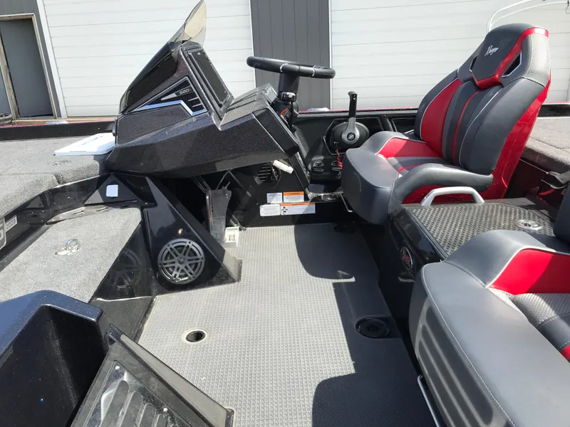 Slide: The Image of 2023 Ranger Z520R Ranger Cup boat interior with steering console and seating. - 23
