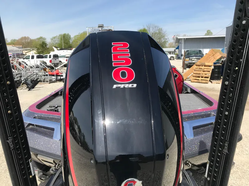 Slide: The Image of 2023 Ranger Z520R boat with 250 Pro engine, parked outdoors. - 29