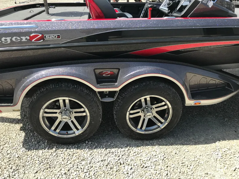 Slide: The Image of 2023 Ranger Z520R boat trailer with dual wheels, sleek design, and red accents. - 32