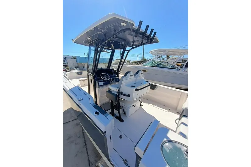 Slide: The Image of 2025 Robalo R300 Center Console boat with sleek design and modern features. - 10