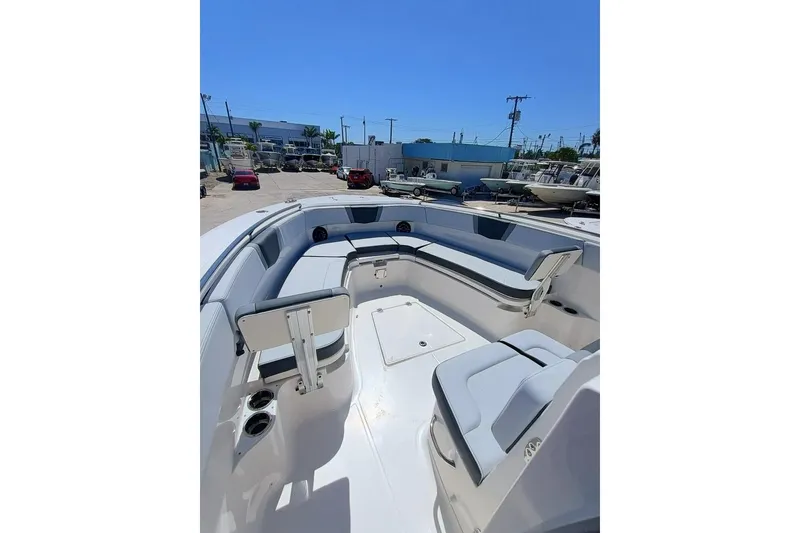 Slide: The Image of 2025 Robalo R300 Center Console boat with spacious seating and modern design. - 6