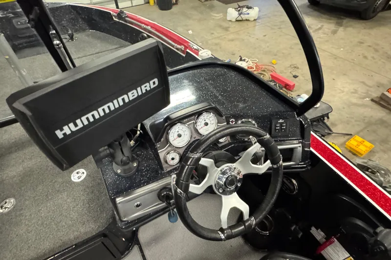 Slide: The Image of 2022 Nitro ZV20 boat dashboard with Humminbird display and steering wheel. - 11