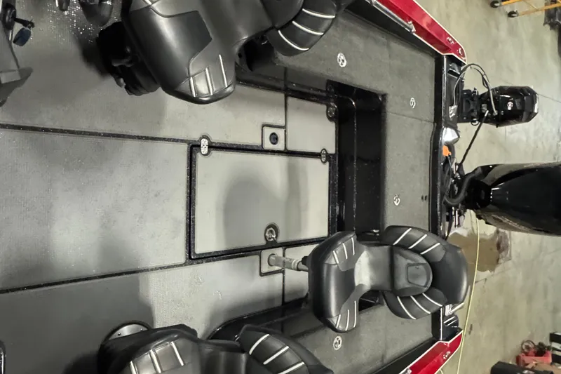 Slide: The Image of 2022 Nitro ZV20 boat interior with black seats and motor, showcasing spacious design. - 19