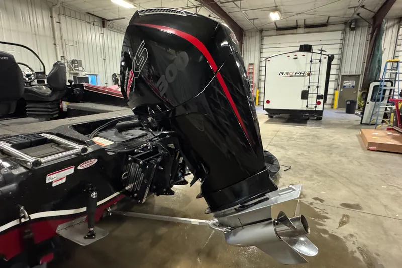 Slide: The Image of 2022 Nitro ZV20 boat with powerful outboard motor in a spacious garage. - 6