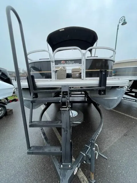 Slide: The Image of 2022 Sun Tracker Bass Buggy 16 XL Select pontoon boat on trailer, front view. - 4