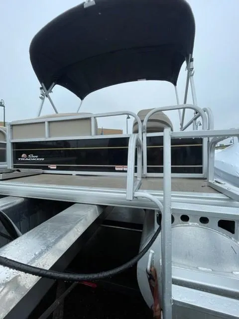 Slide: The Image of 2022 Sun Tracker Bass Buggy 16 XL Select pontoon boat with canopy, rear view. - 5