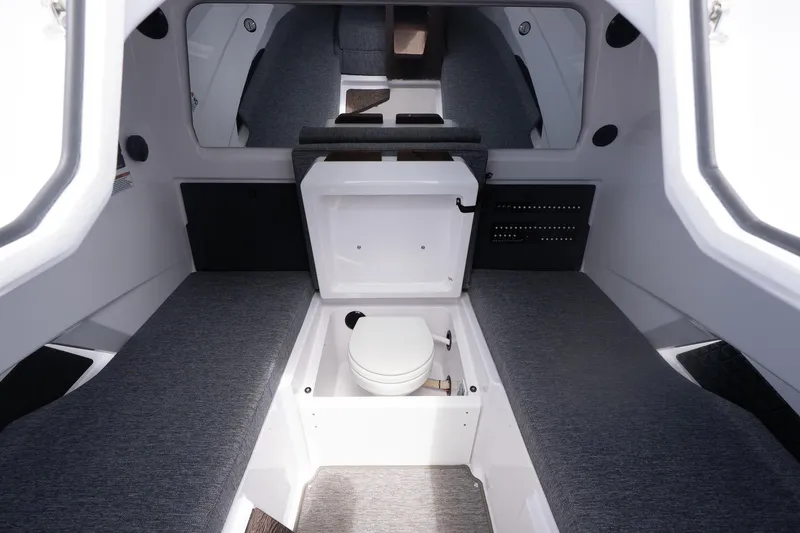 Slide: The Image of 2026 Axopar 29 XC Cross Cabin with spacious seating and solar panel roof. - 24